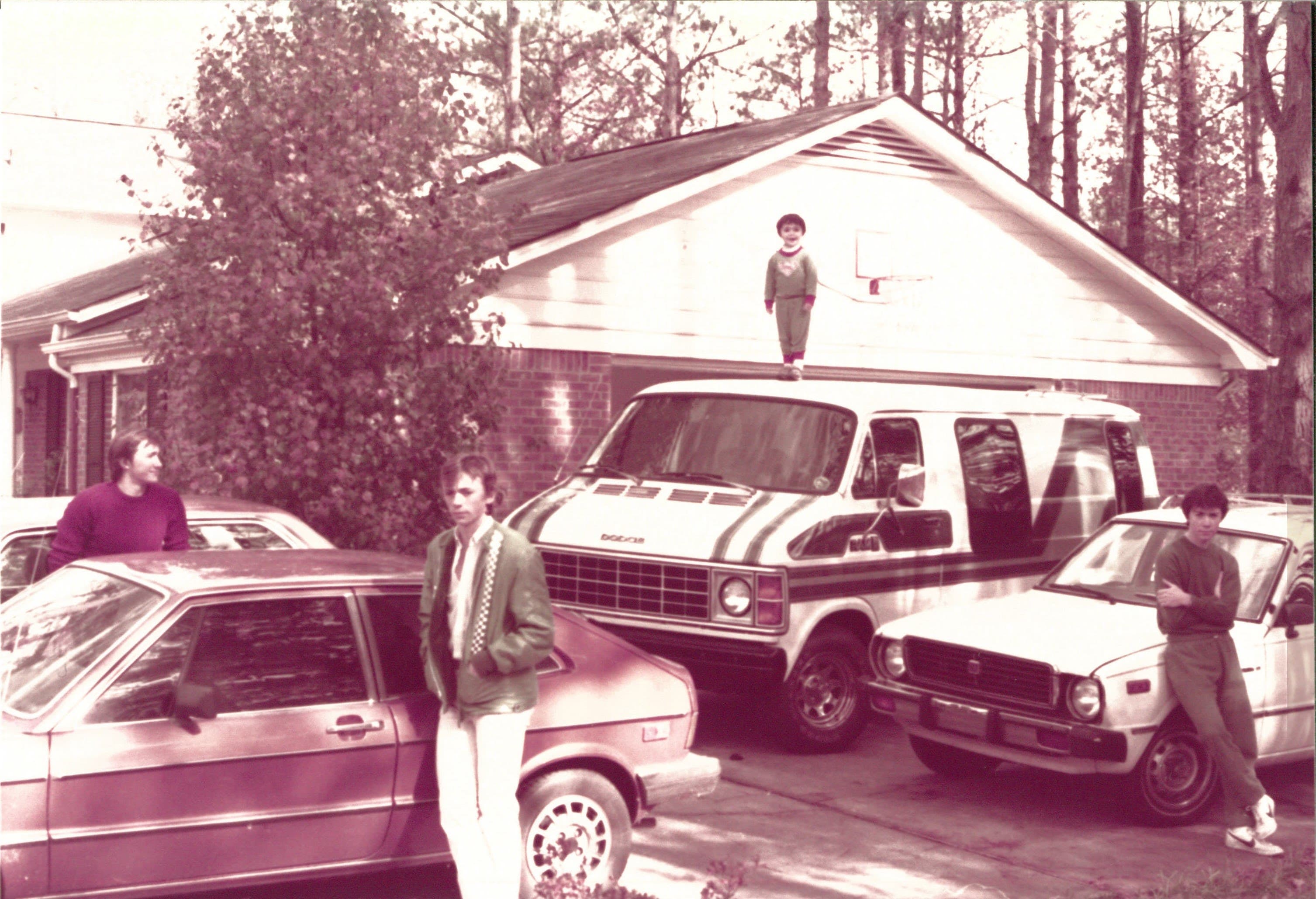 Peter and his family with classic cars