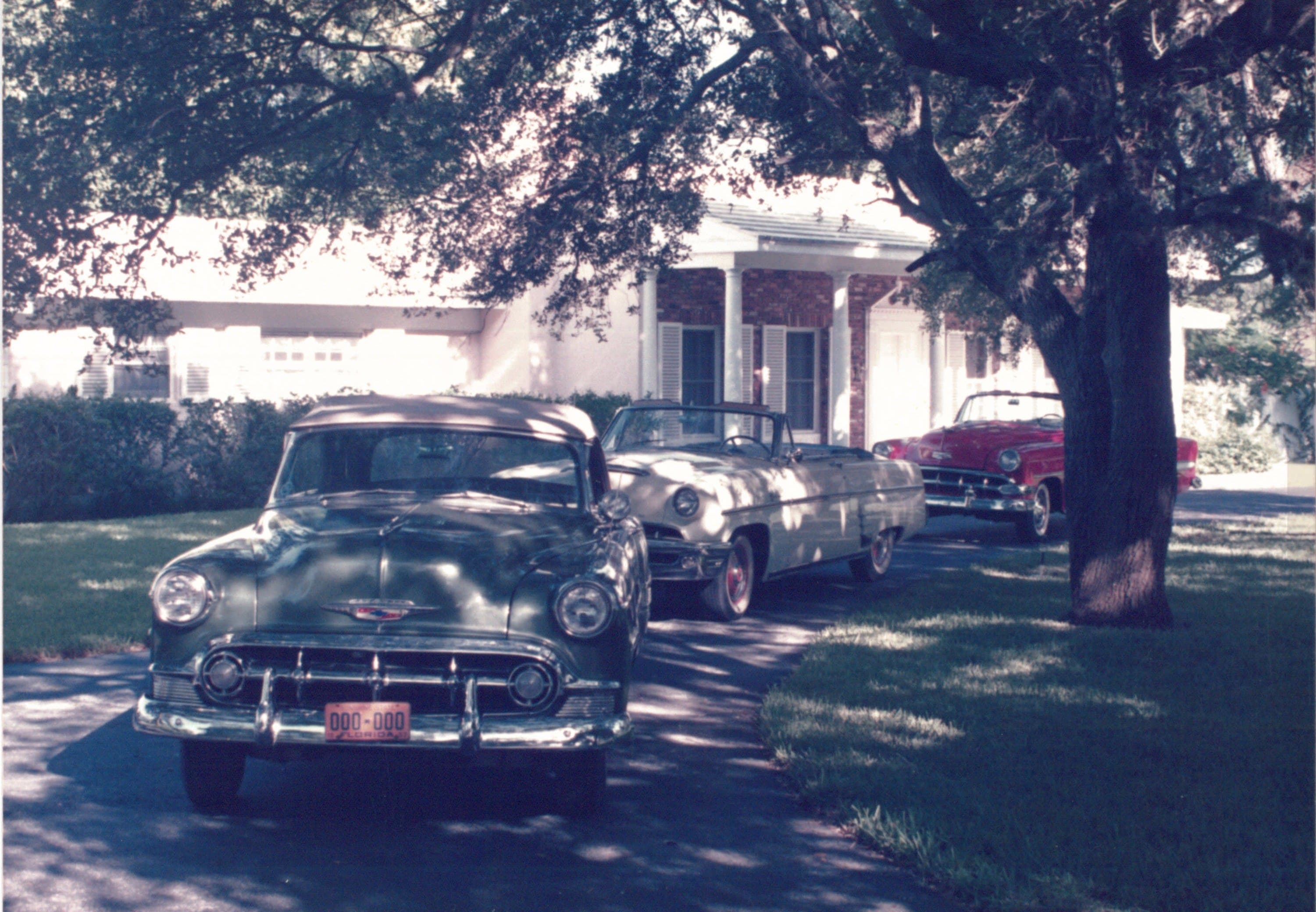 Peter and his family with classic cars