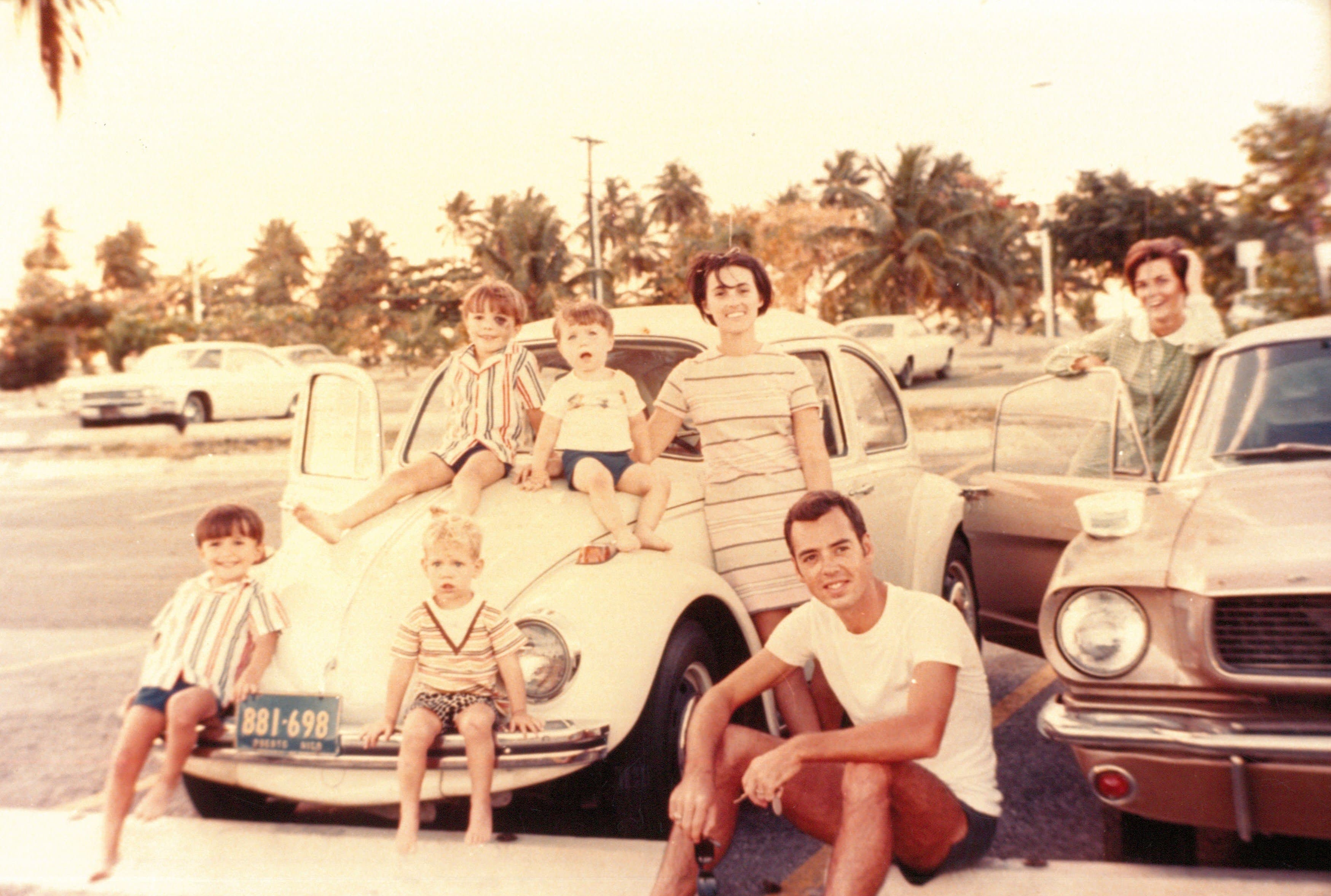 Peter and his family with classic cars