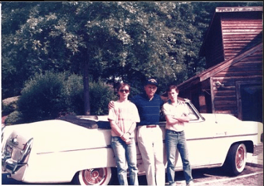 Peter and his family with classic cars