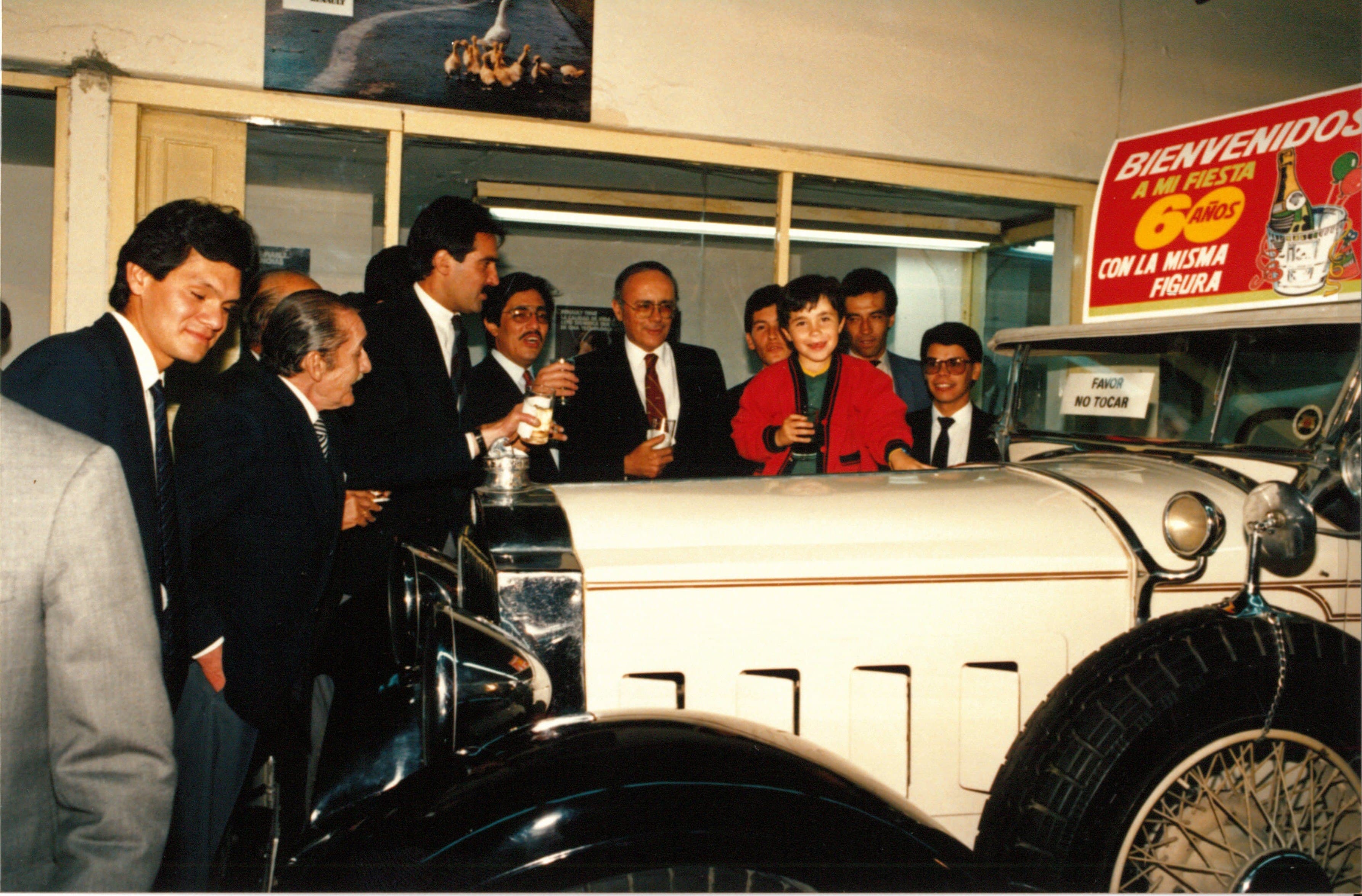 Peter and his family with classic cars